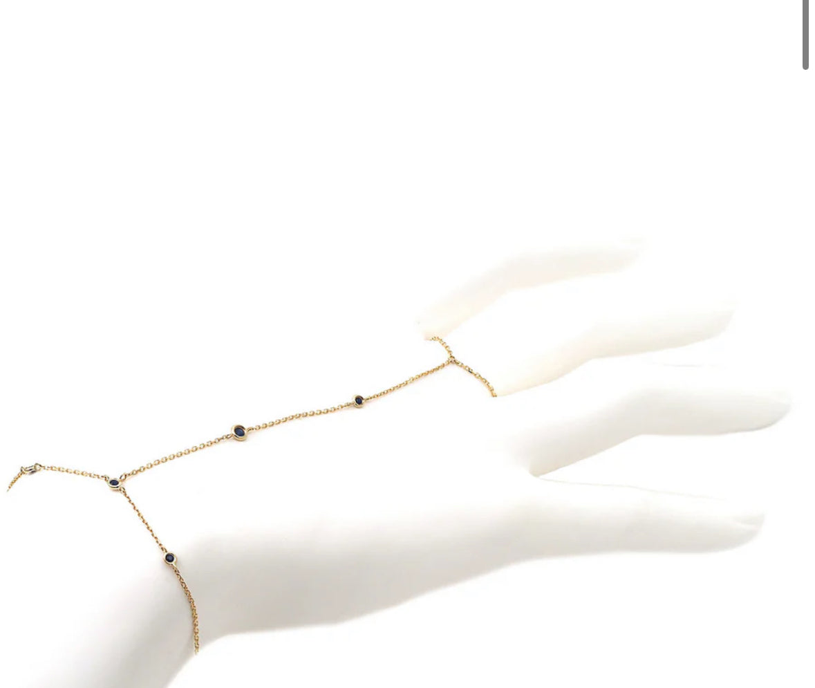 YELLOW GOLD HAND CHAIN ROUND BEZEL SAPPHIRE BRACELET