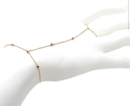 YELLOW GOLD HAND CHAIN ROUND BEZEL RUBY BRACELET